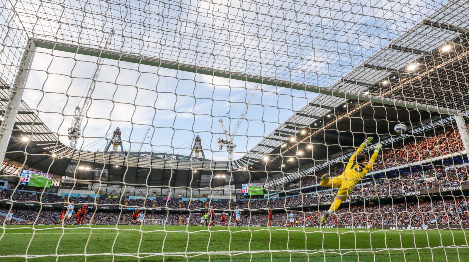 Manchester City's Omar Marmoush scores the opening goal past Bournemouth's Kepa Arrizabalaga during the Premier League match between Manchester City and AFC Bournemouth at Etihad Stadium on May 20, 2025